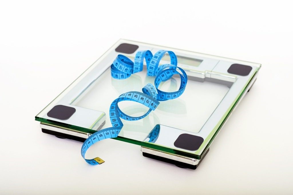scale with measuring tape on top - tools to use along with The Starch Solution Diet
